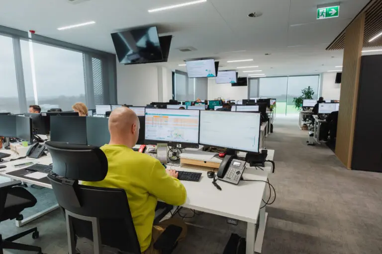 Egala control tower office in Poznań with teams managing European trucking operations using digital systems and real-time data.
