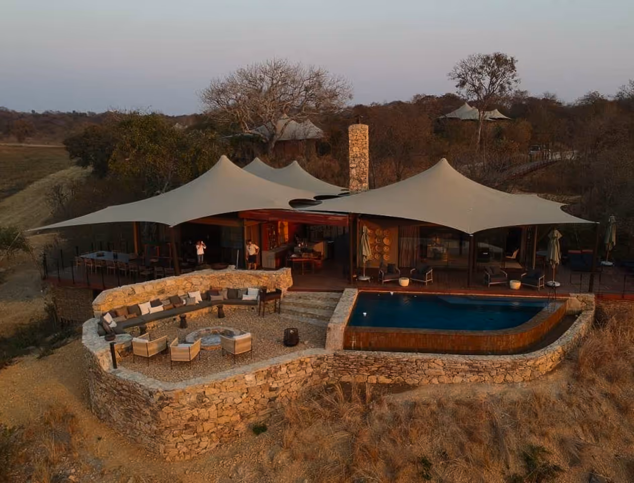 A large tent with a pool in the middle of it.