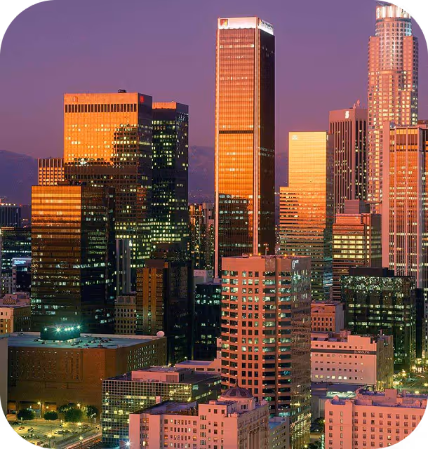 A view of a city at night from the top of a building.