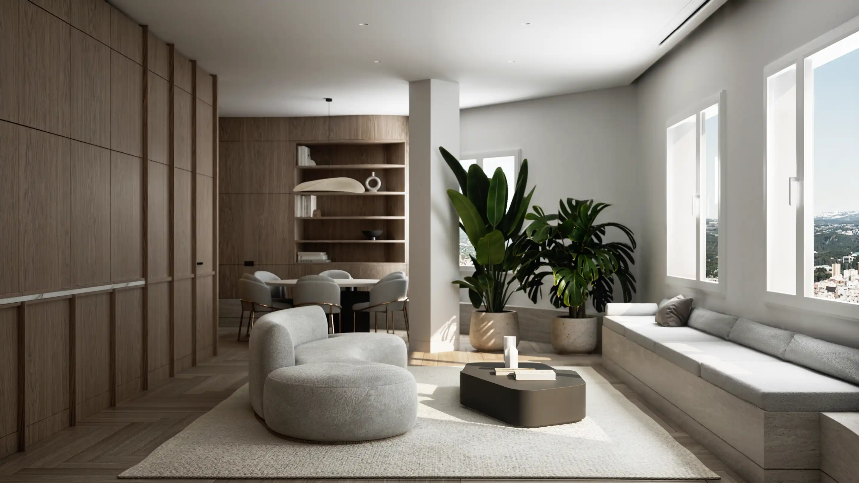 Open living room with seating area, indoor plants and natural light.