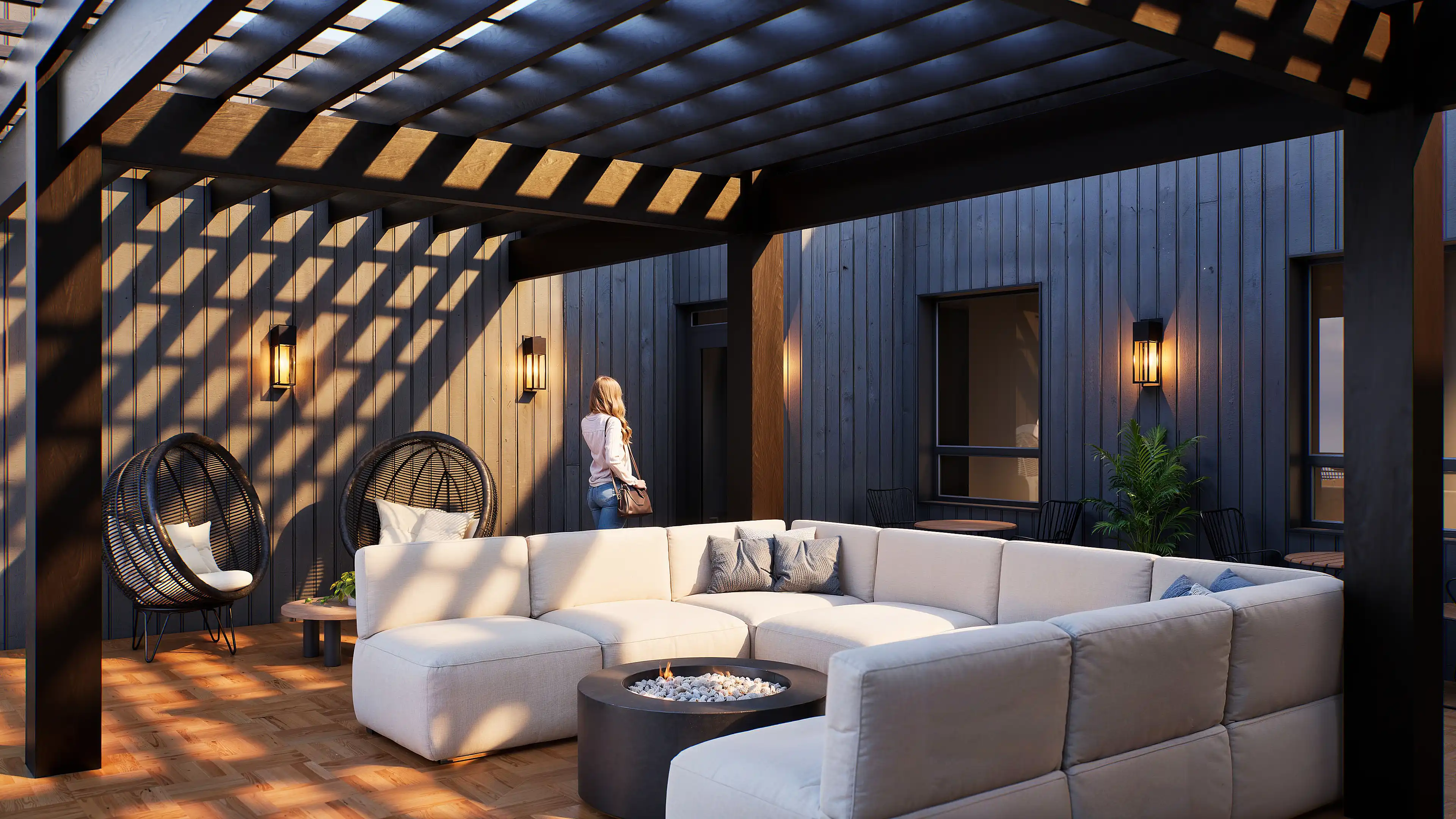 Exterior courtyard lounge with white bean bags and seating under pergola.