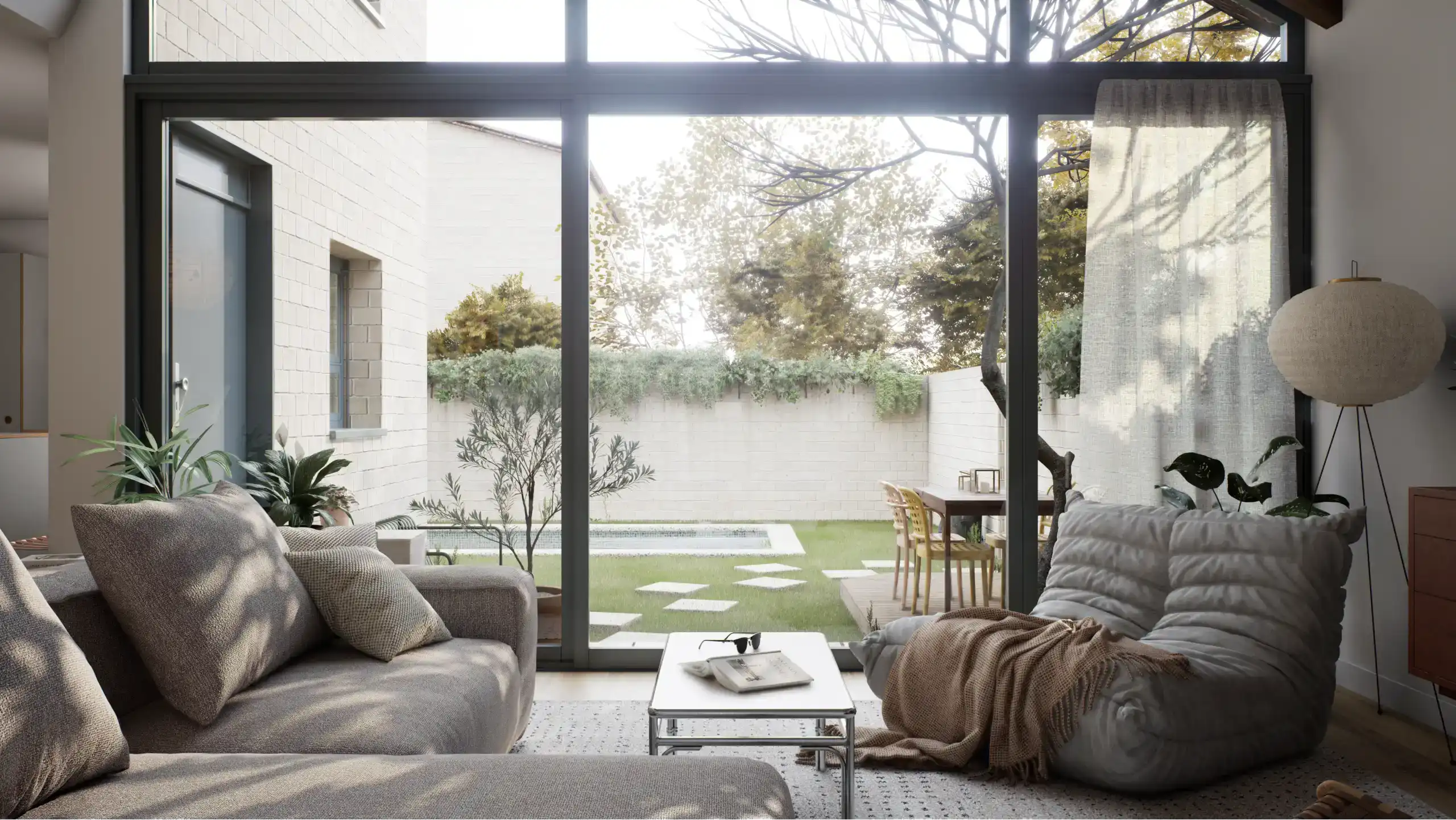 Living room with glass doors opening to private garden area.
