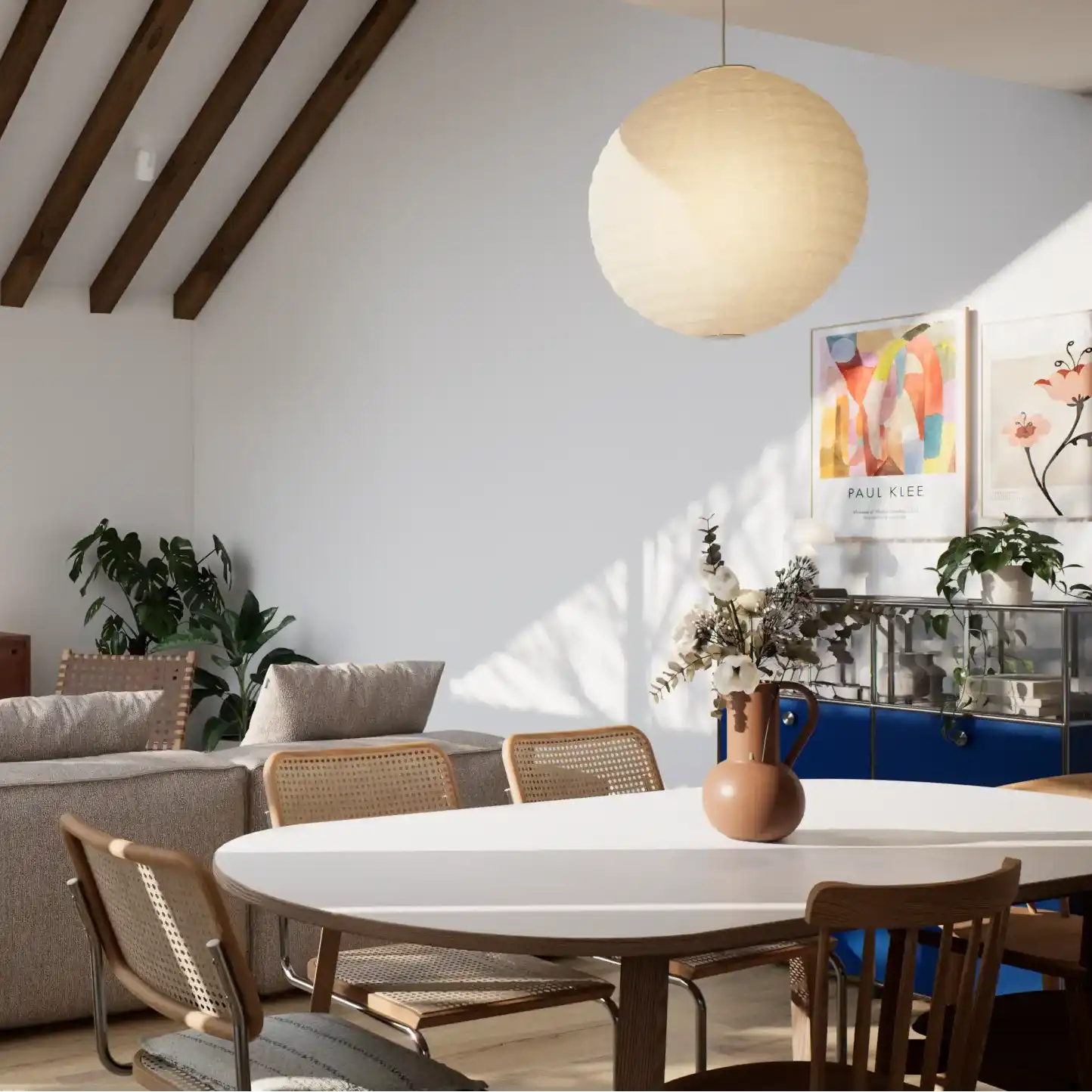 Living room side view with sloped ceiling and wooden beams.