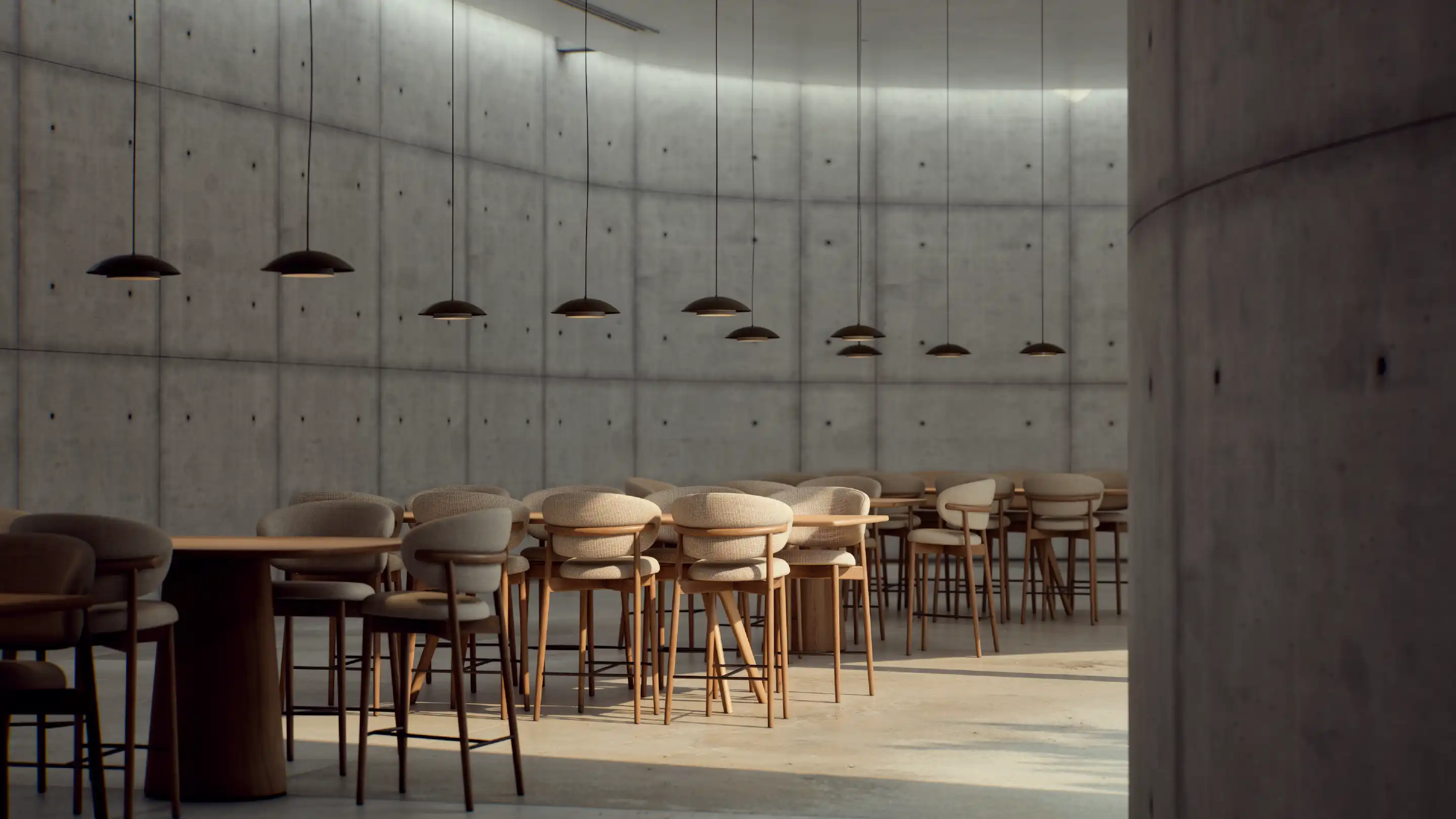 Concrete wall with custom shelves displaying books and decorative objects.