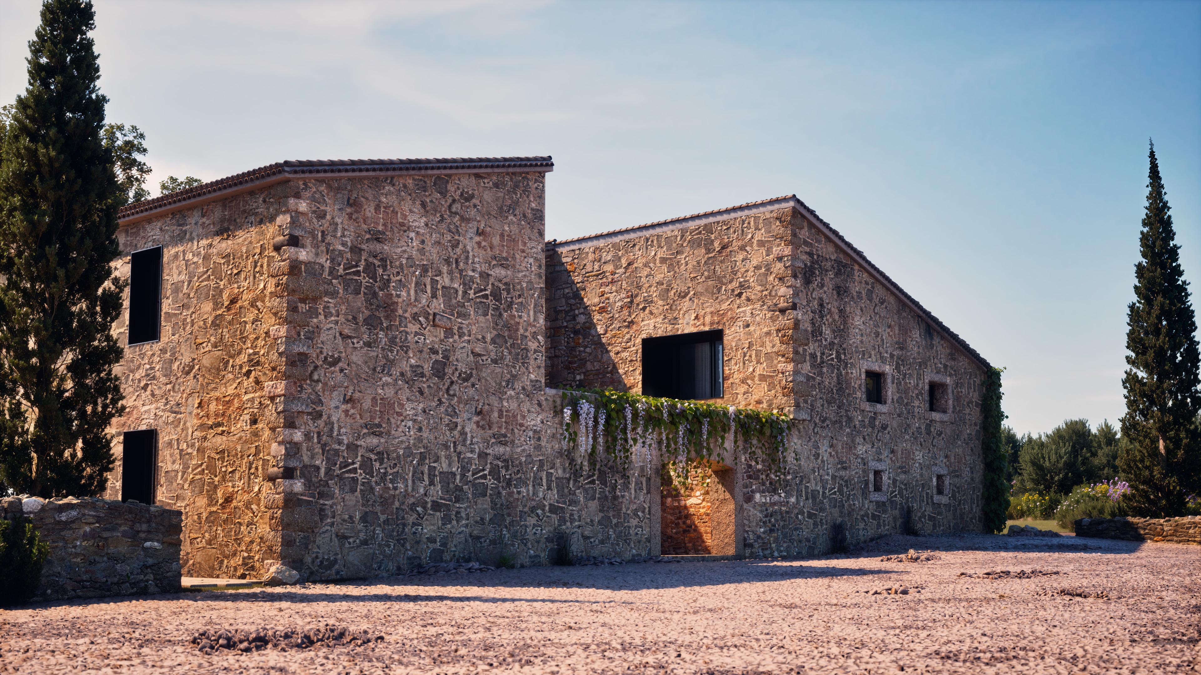 Stone house courtyard with natural textures and warm daylight.