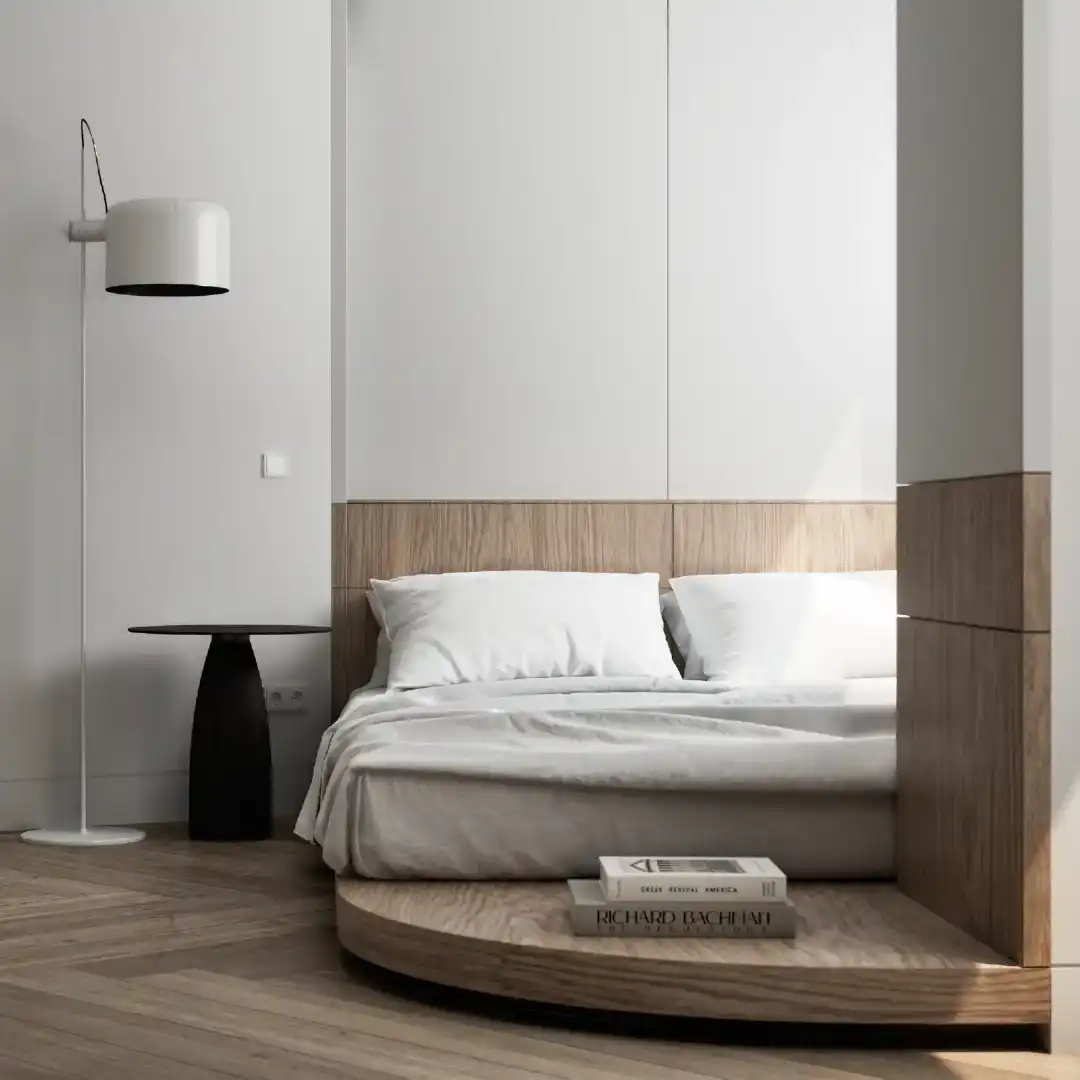 Bedroom side view with floor lamp and soft neutral materials.