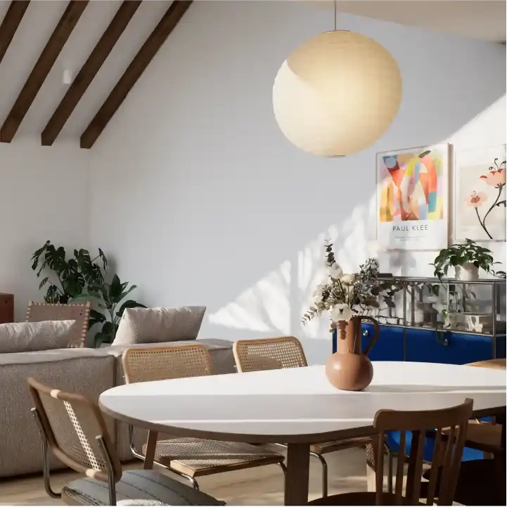 Living room side view with sloped ceiling and wooden beams.