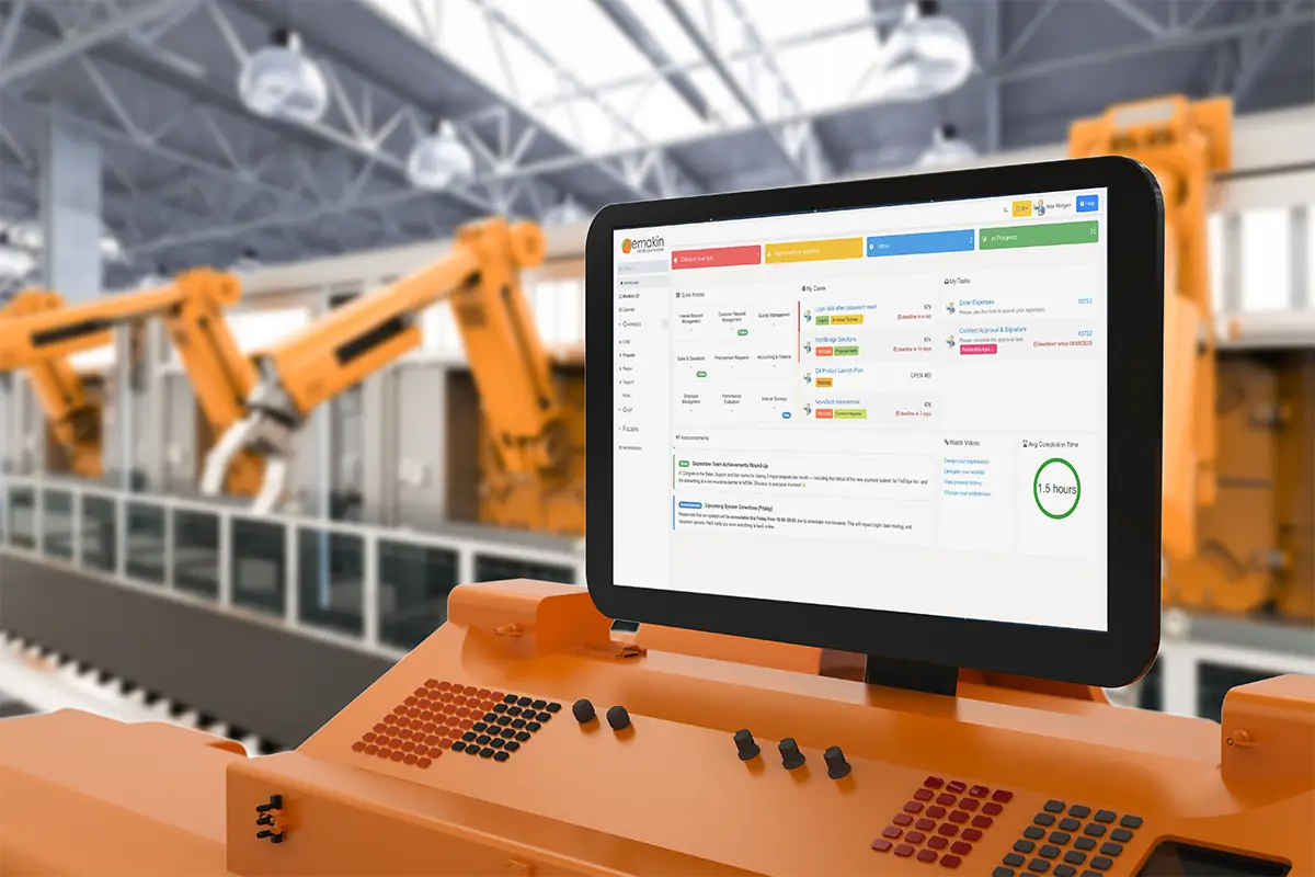 Control panel with a touchscreen displaying a workflow dashboard in an industrial setting with robotic arms in the background.