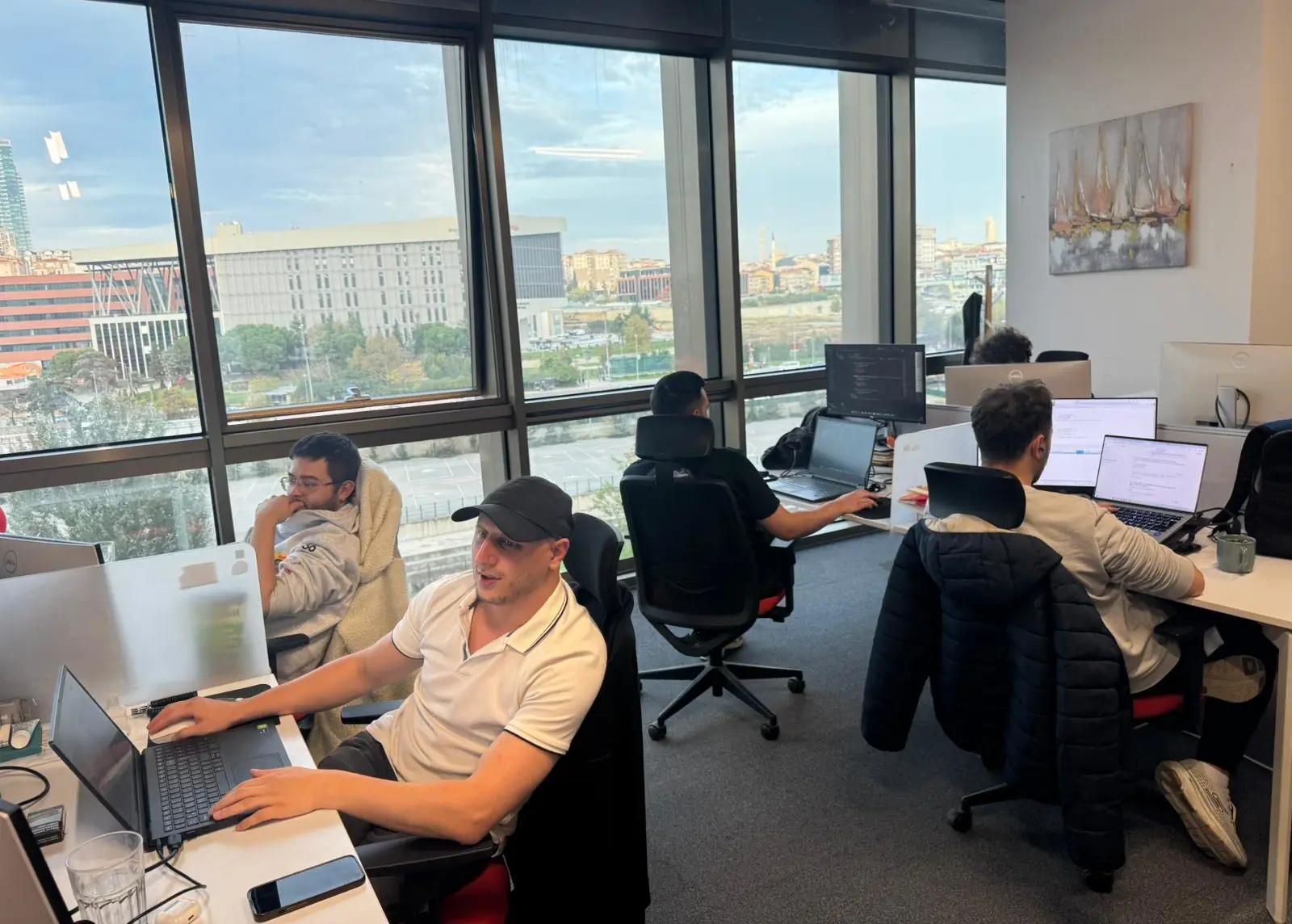 Emakin team members working at office.