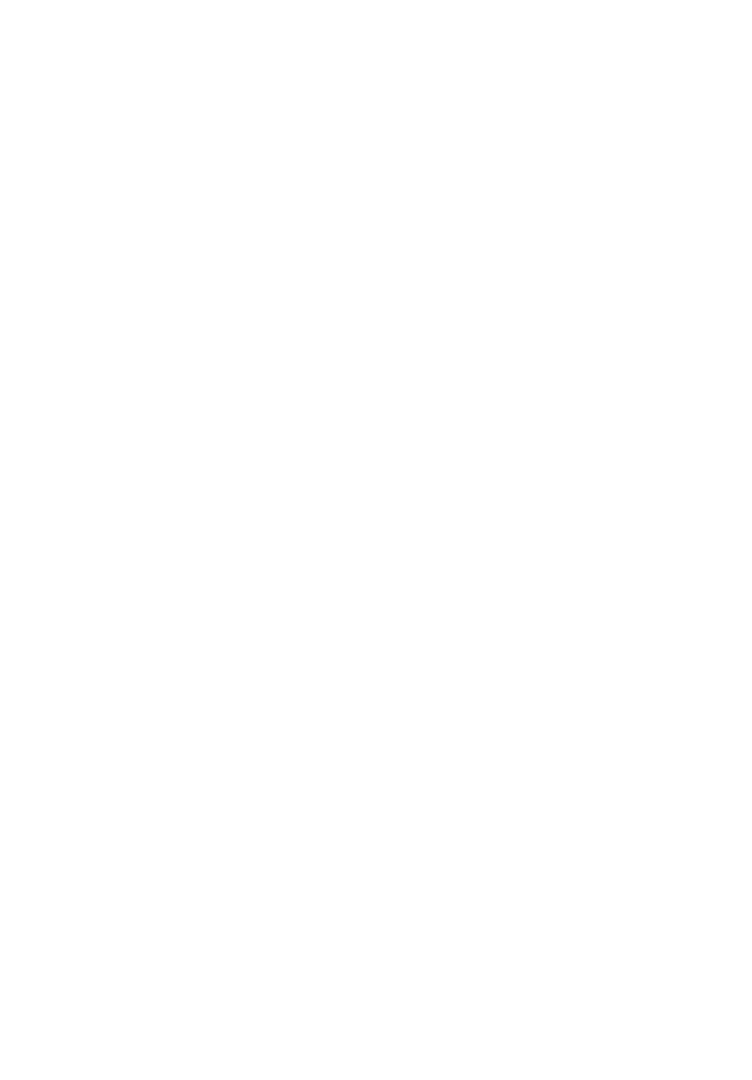 Smiling man with glasses and beard wearing a smart casual blazer and holding a smartphone in an outdoor urban setting with cars and crowds in the background.