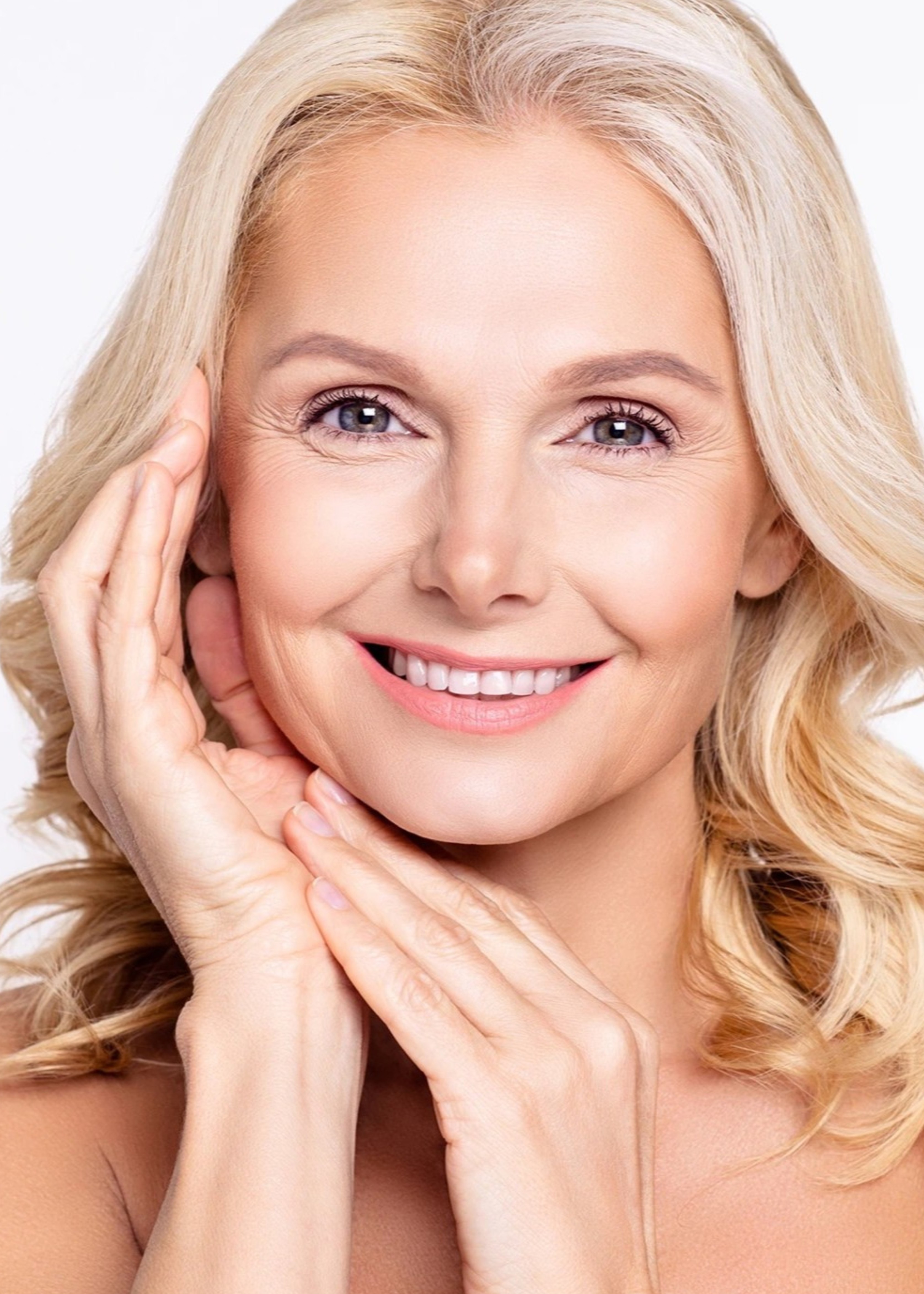 A beautiful blonde woman posing for a picture.