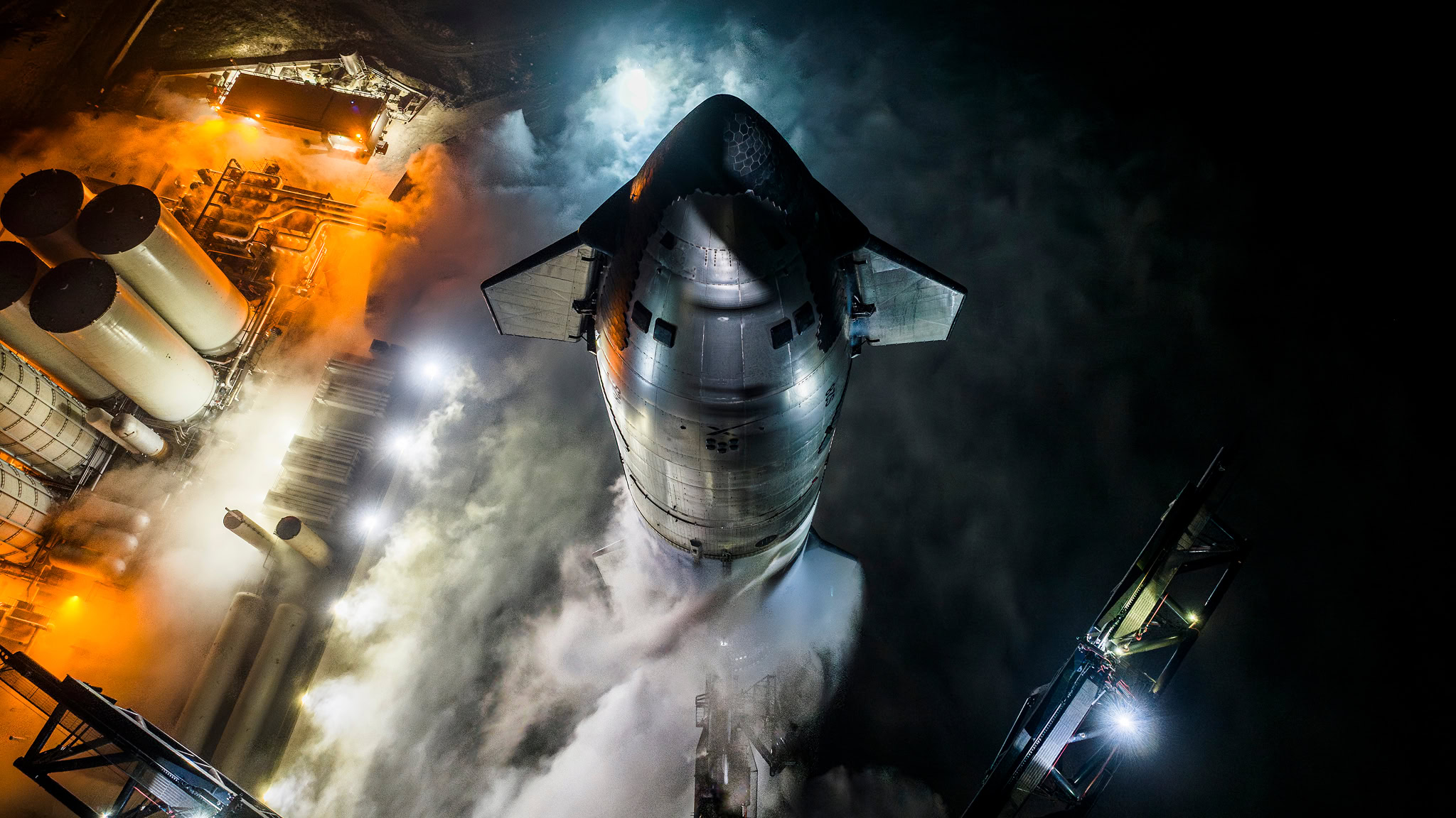SpaceX Starship on the launch pad at night — the infrastructure powering the space economy ahead of a highly anticipated SpaceX IPO