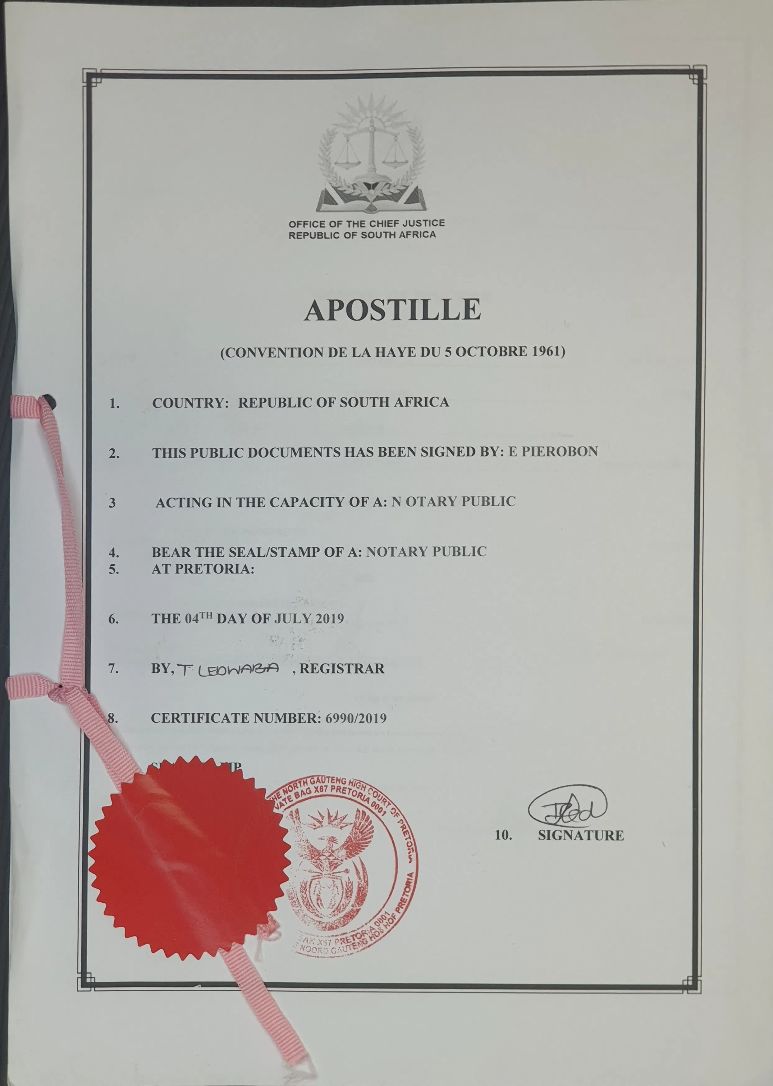 Apostille certificate from the Office of the Chief Justice, Republic of South Africa, dated 4th July 2019, with a red seal and official stamps.