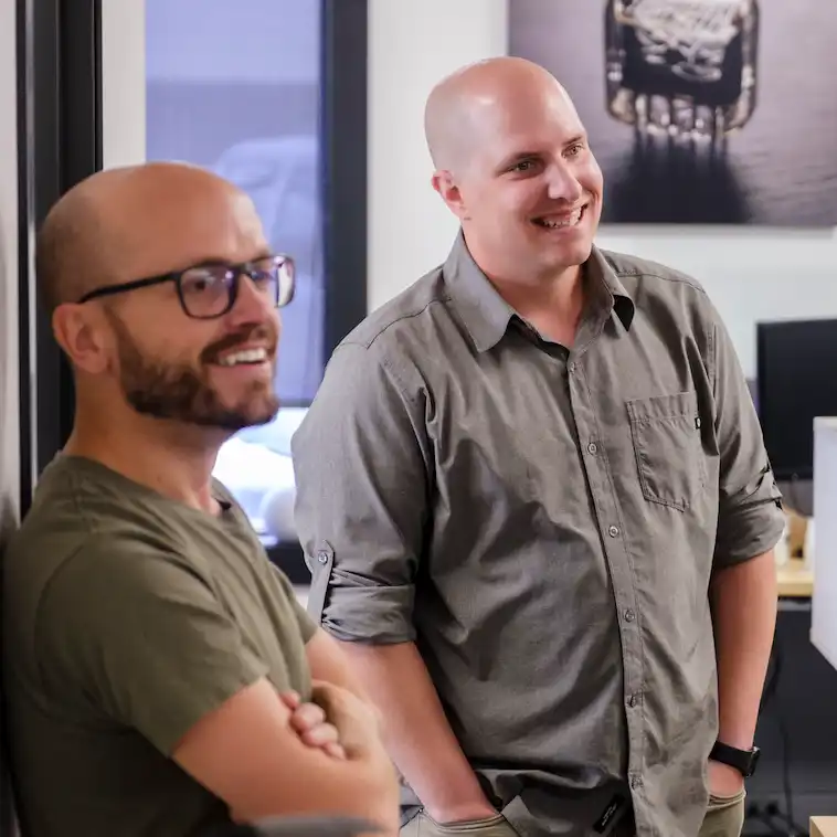 Two men laughing.