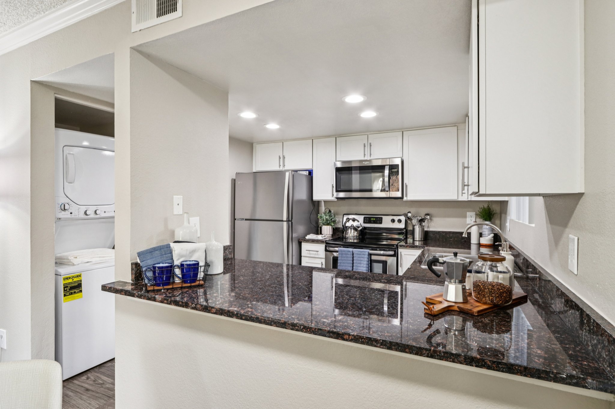 Kitchen with stainless steel appliances and white cabinets