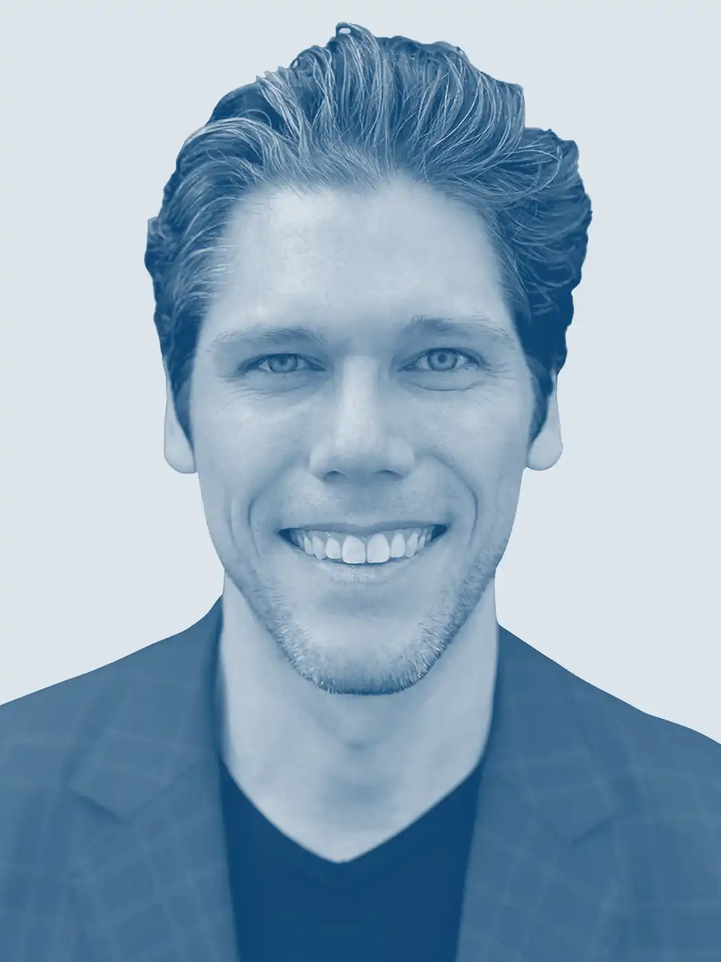 A headshot of a man smiling with brown hair wearing a blue business jacket with a blue overlay effect on the image