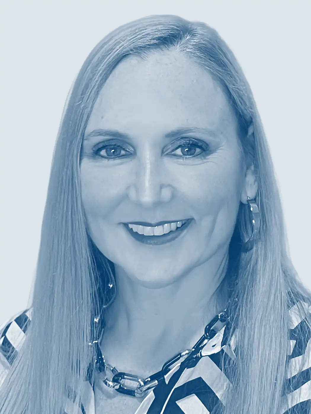 A headshot of a woman smiling with blonde hair wearing a striped top with a blue overlay effect on the image