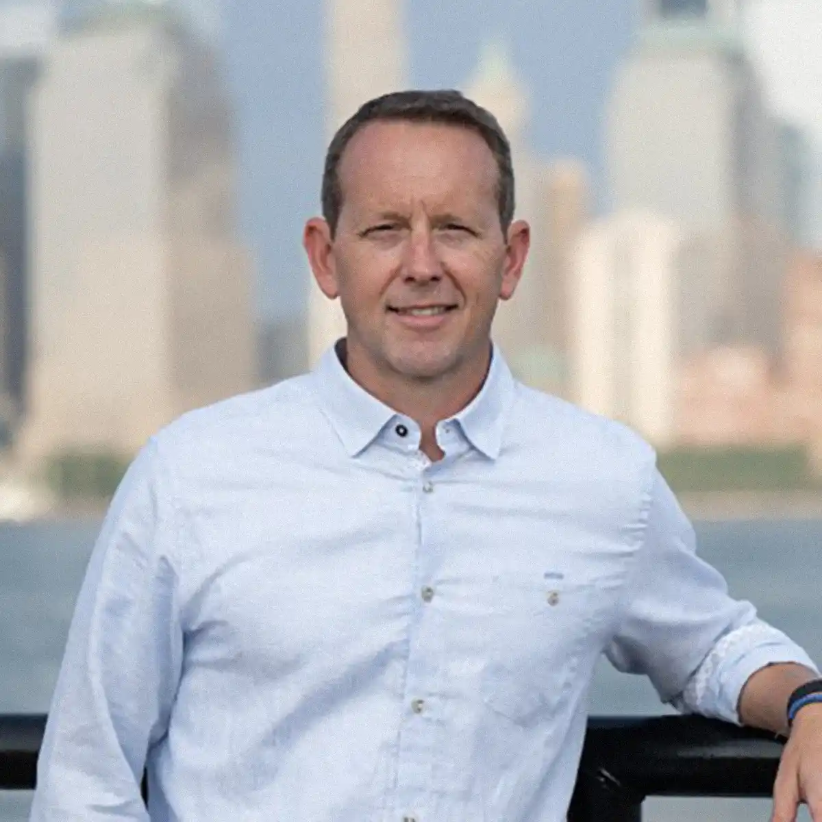 portrait of an executive against a skyline background
