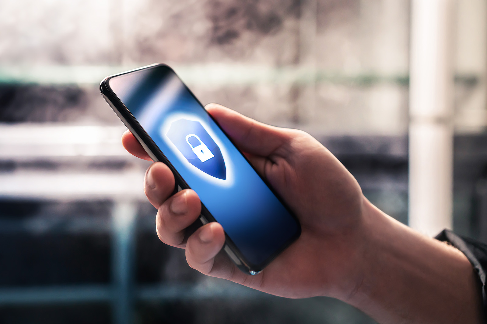 a hand holding a mobile phone
