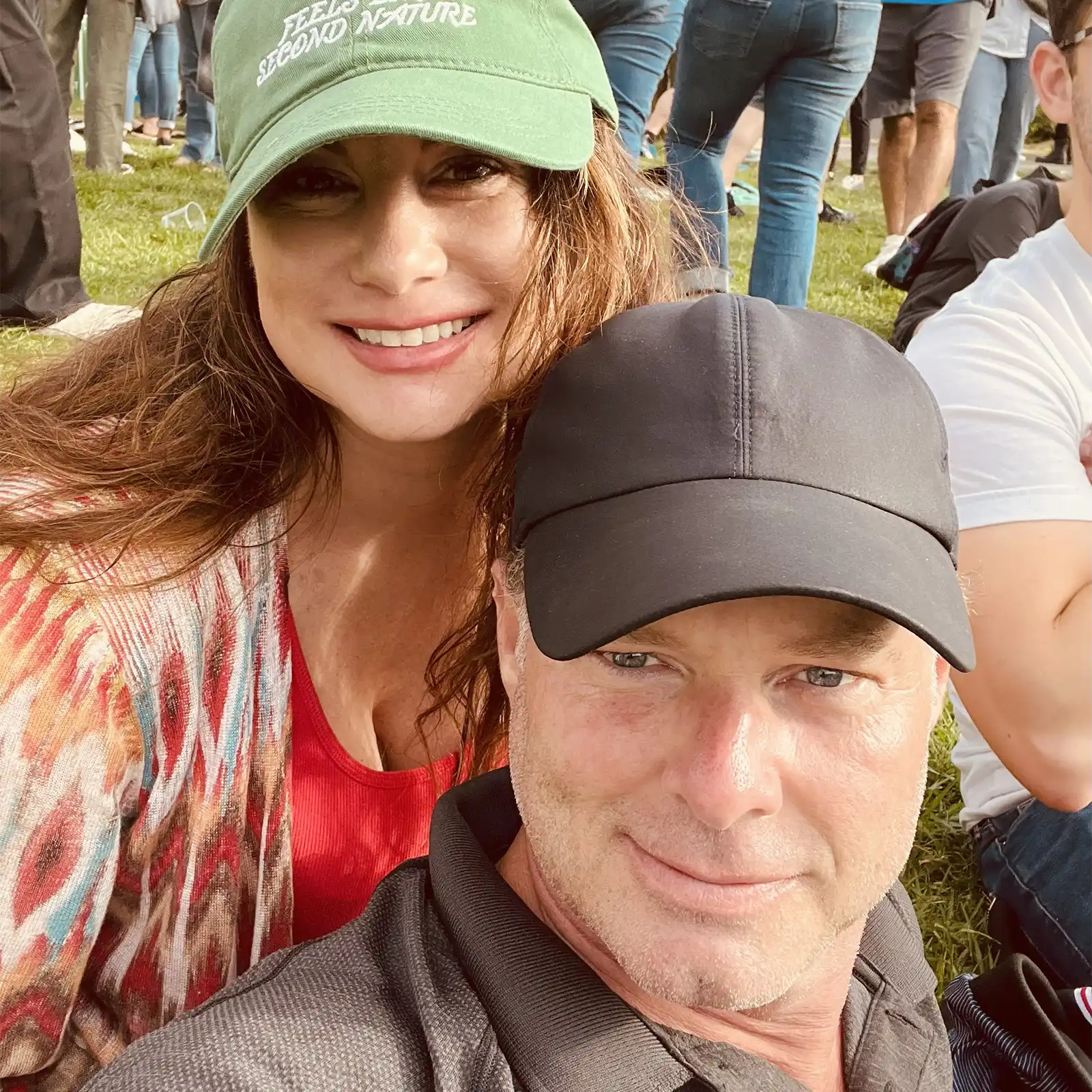 a man and woman wearing hats at a festival