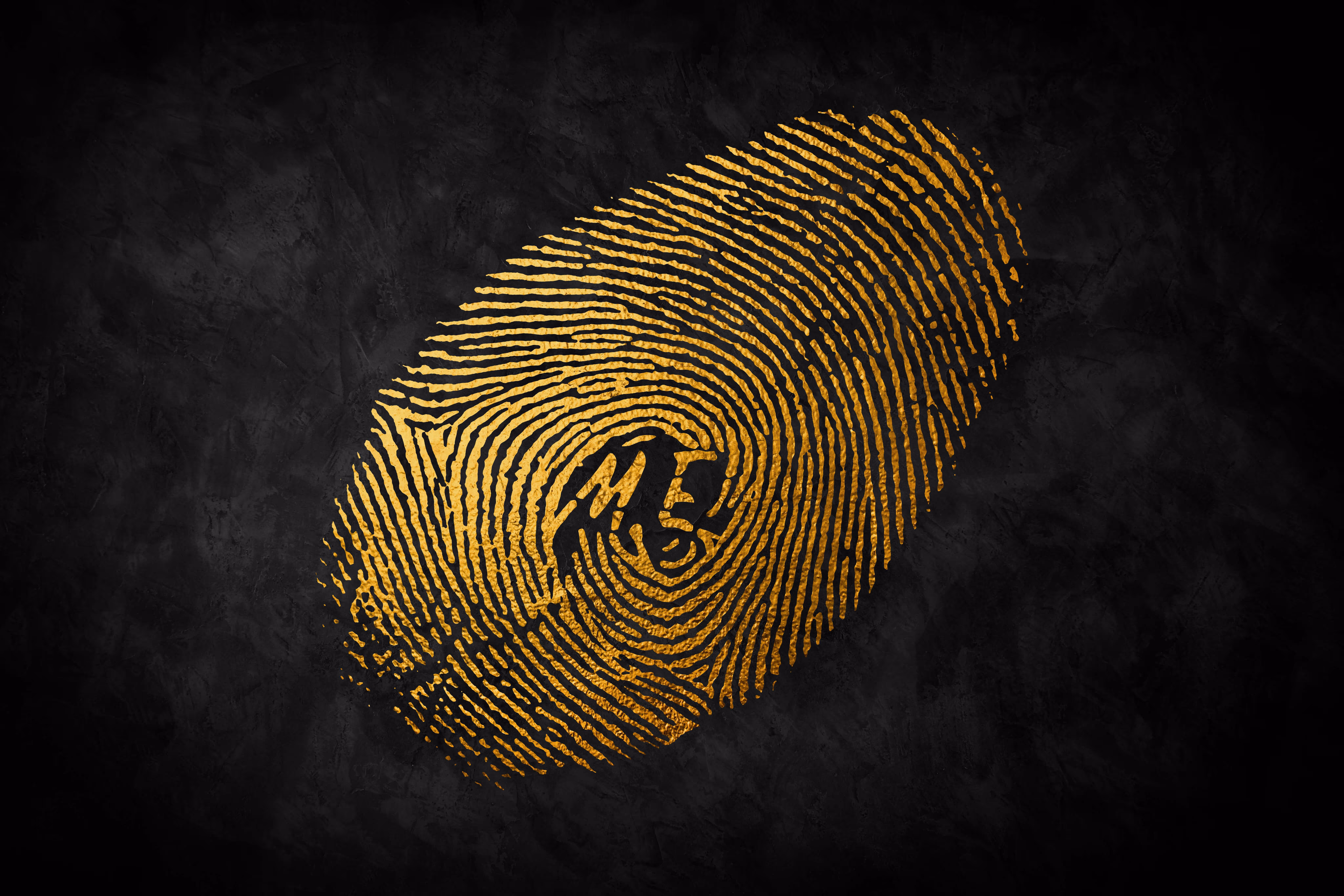 Gold fingerprint illustration with the word ‘ME’ at the center on black