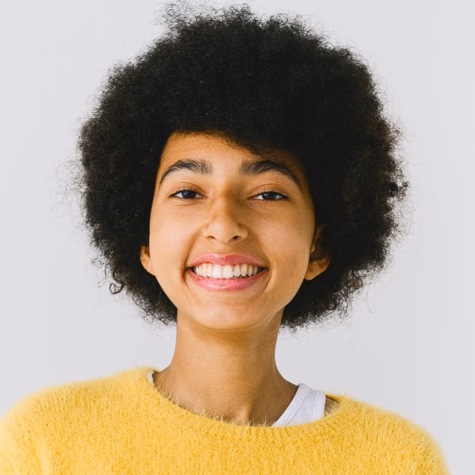 Woman team member wearing yellow sweater