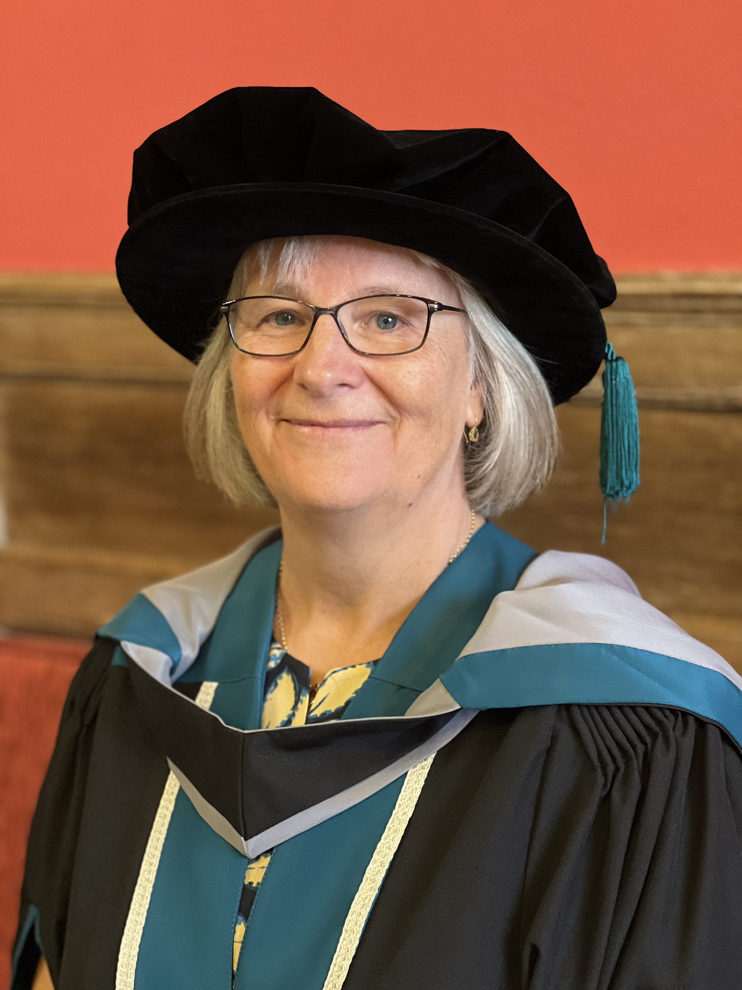 A portrait of Kate Sheehan wearing University of Worcester academic dress.