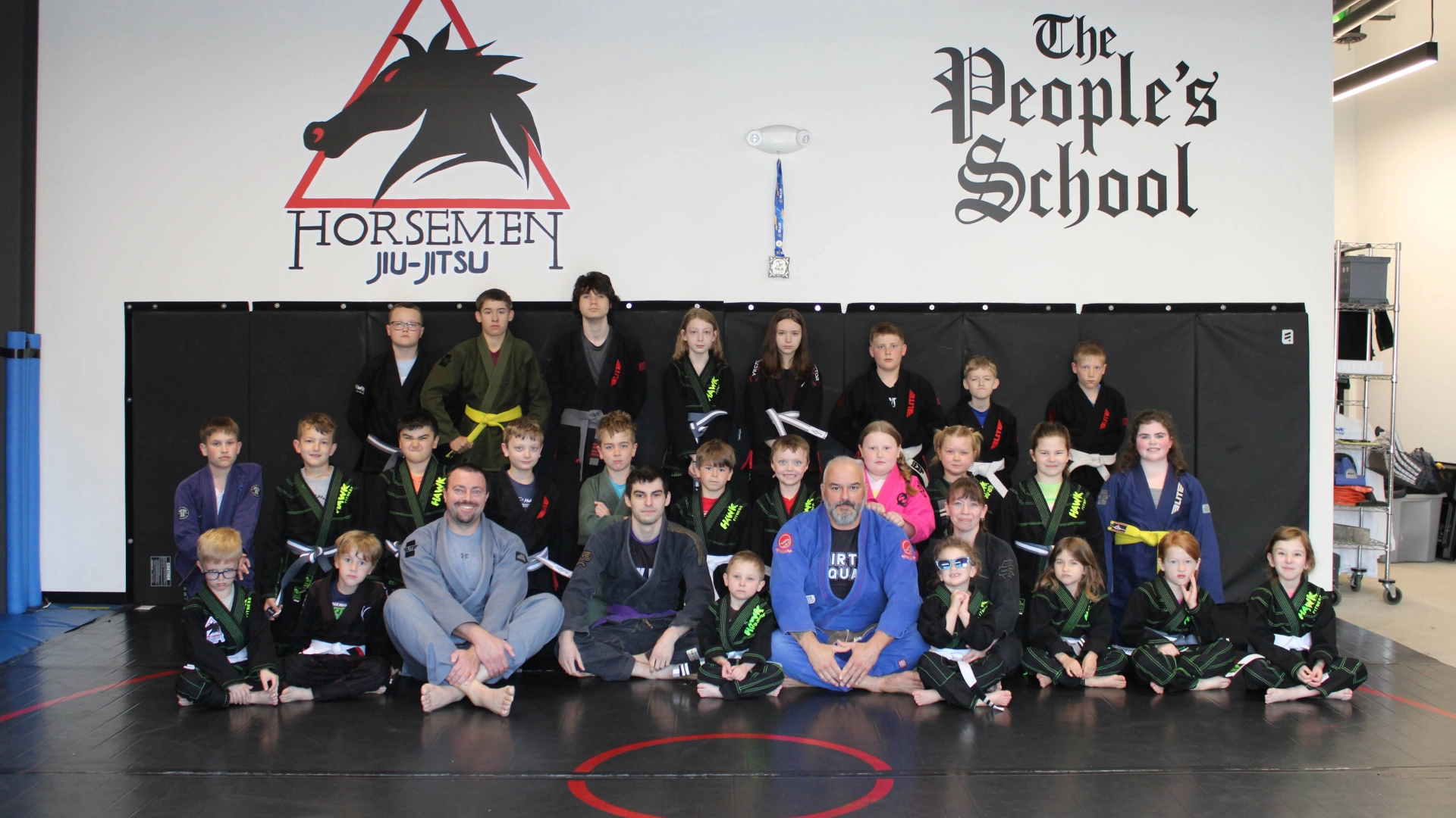 Signage for The People's School of Martial Arts located at Horsemen Brazilian Jiu Jitsu in New Freedom, PA.
