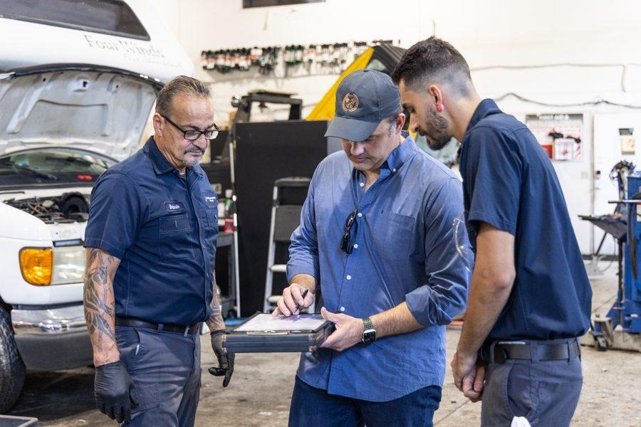 NH Repairs team reviewing service order with client