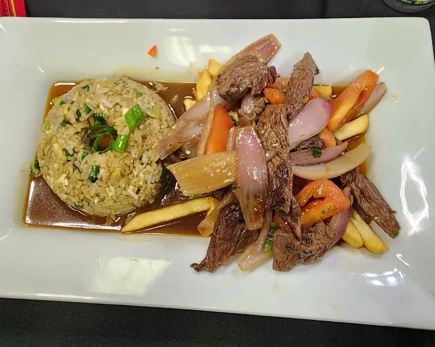 A plate featuring a serving of meat alongside a colorful assortment of vegetables.
