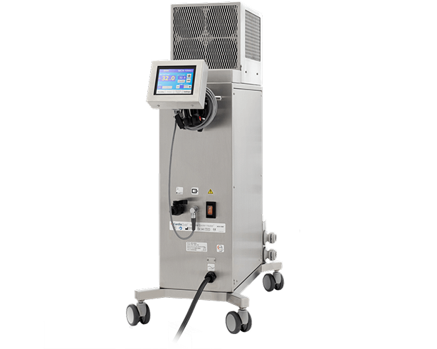 Tall stainless steel medical device on wheels with a digital display screen and connected cables.