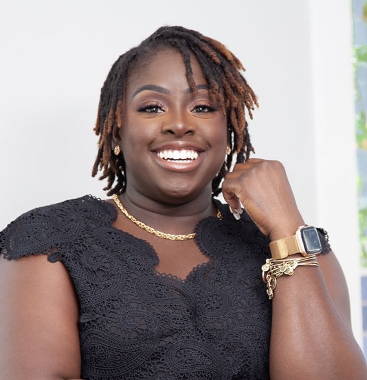 Staff member M. Hawthorne smiling in professional headshot photo