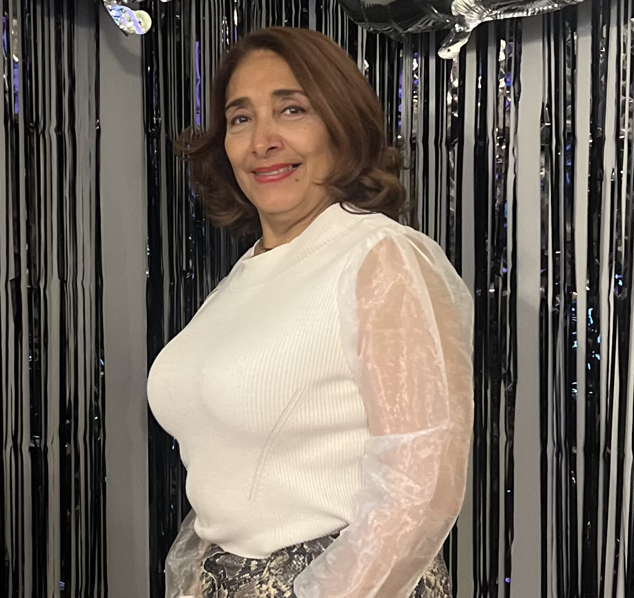 Gina Aldea smiling at a school celebration event