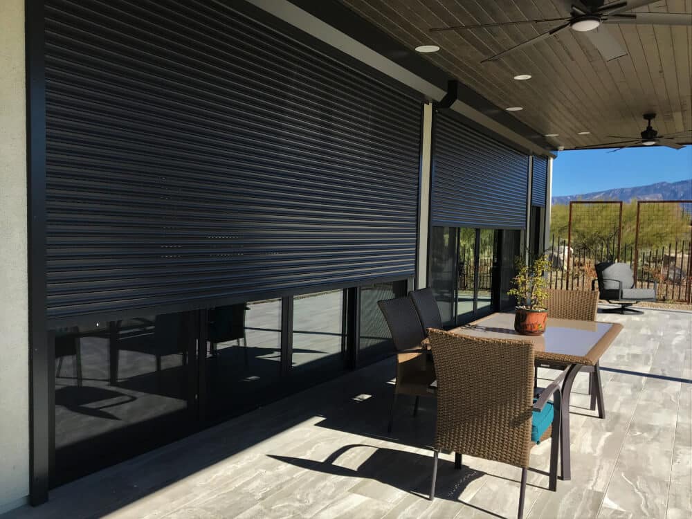 Patio with rolling shutters and outdoor seating, Tucson.
