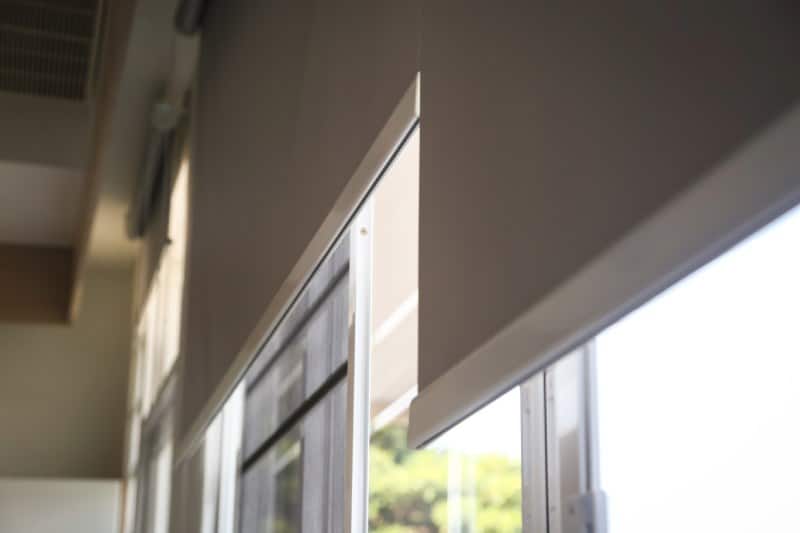 Close-up of interior roller shades near a window, Tucson.