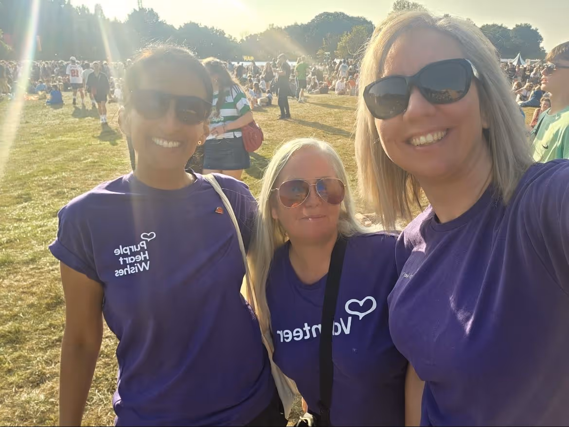 Volunteers in purple tshirts