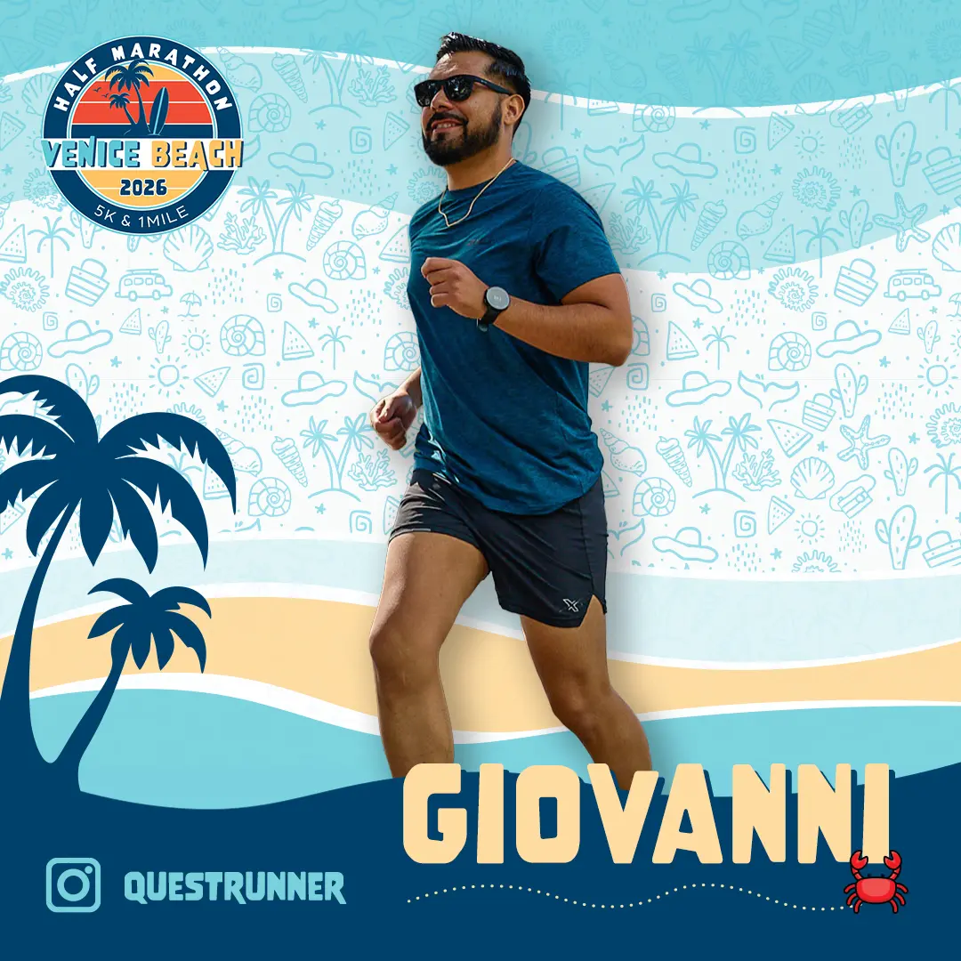 Smiling male runner wearing a sleeveless gray hoodie and black shorts with orange accents, standing in front of a stylized Venice Beach Half Marathon & 5K logo with palm trees and a surfboard.