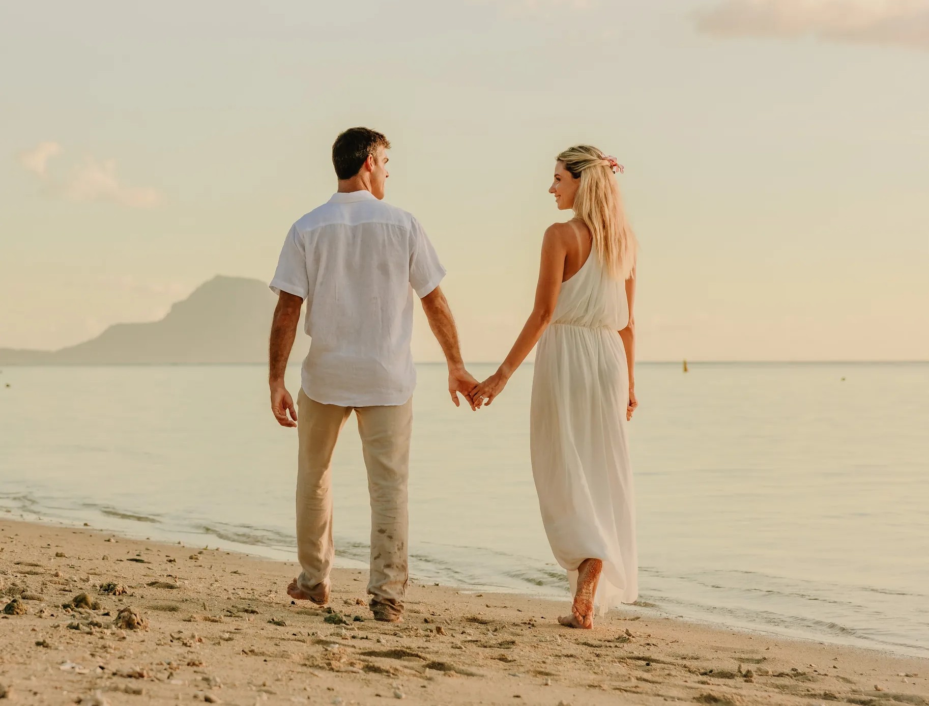 Verdant waterfall landscape in Mauritius with cascading cliffs and tropical foliage—Island Lilly’s immersive nature retreats rooted in serenity and renewal