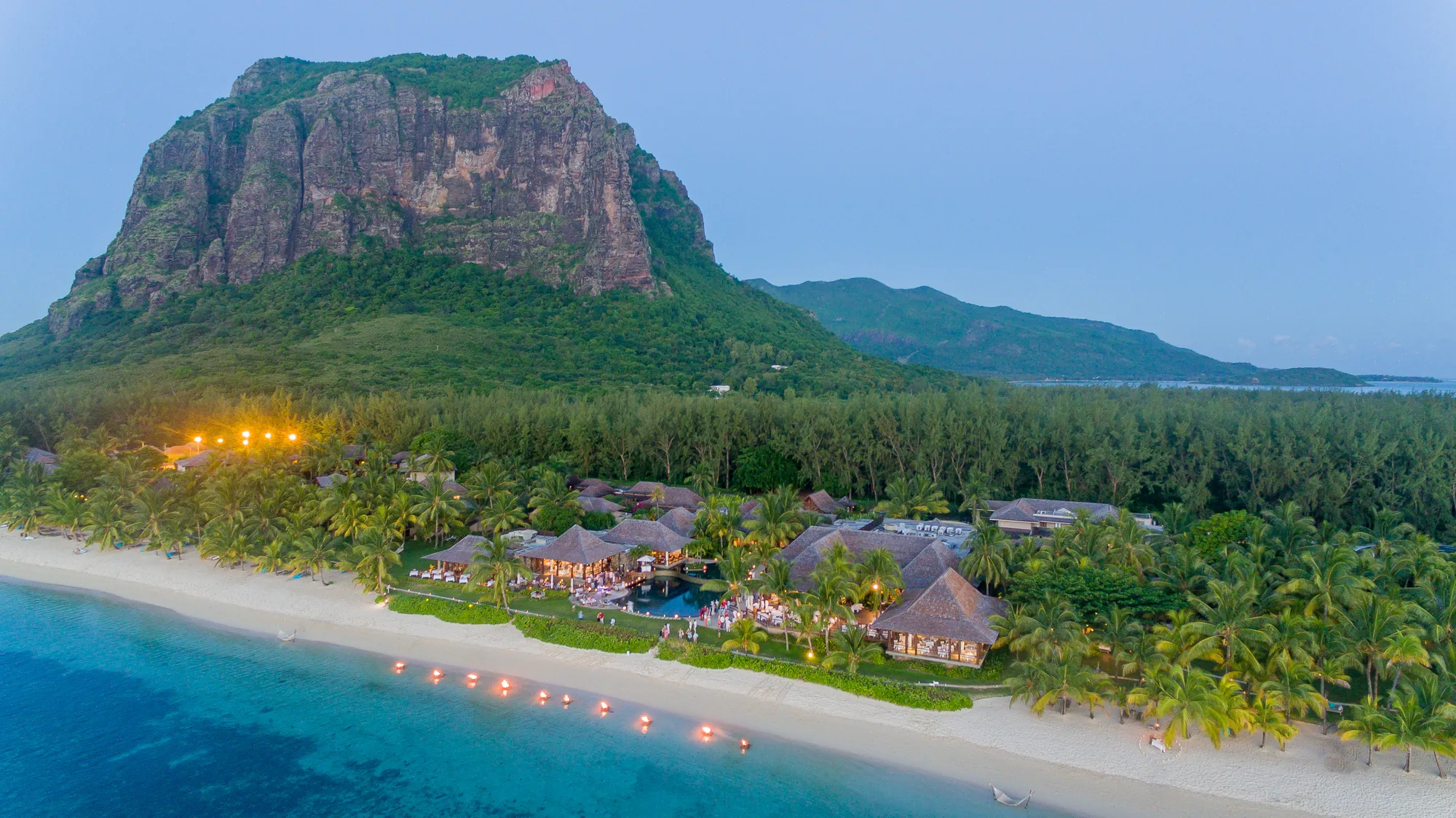 LUX* Le Morne on the beach below Le Morne Brabant mountain, lit at dusk