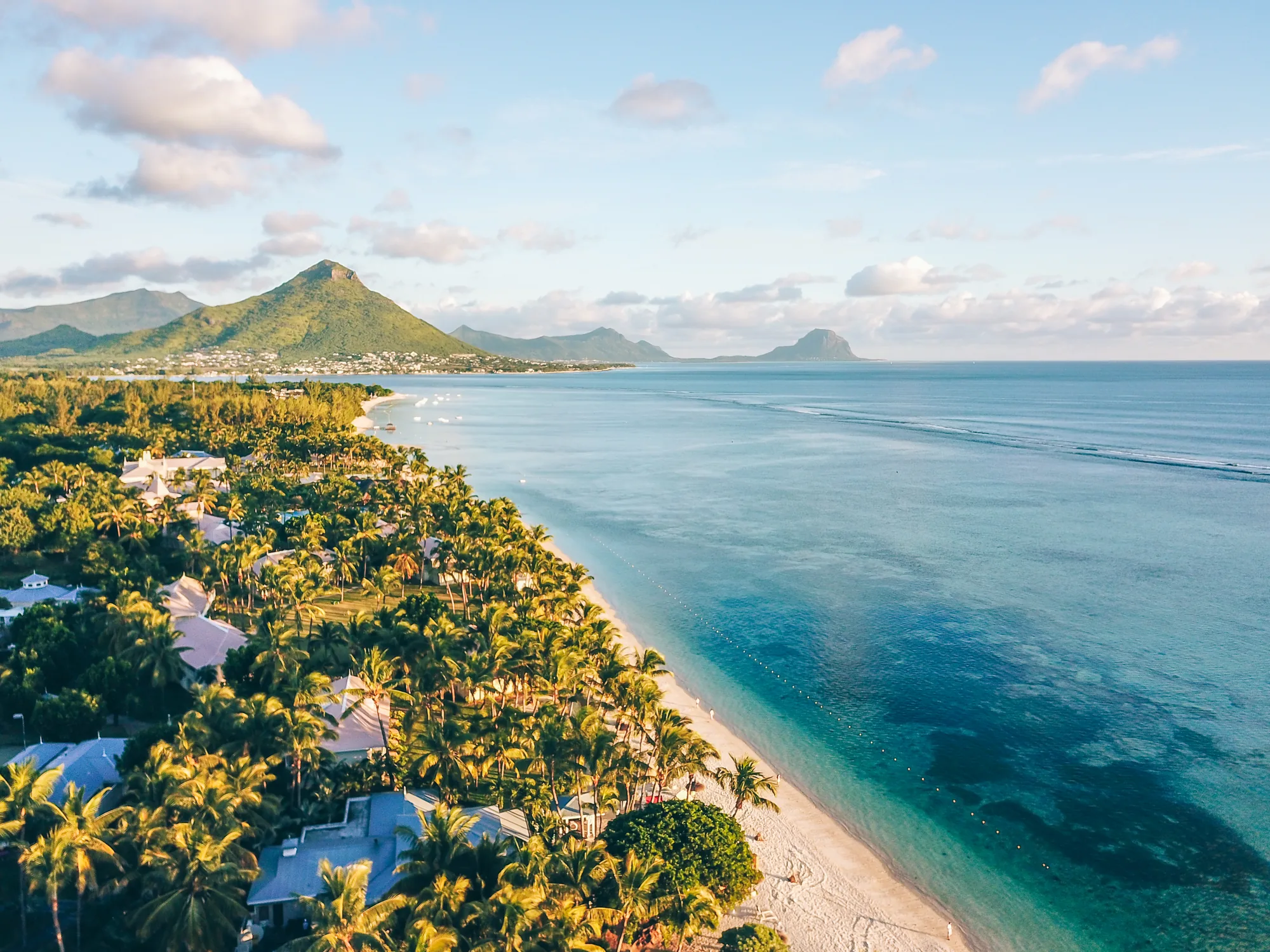 Aerial view of the coast and lagoon, with mountains beyond