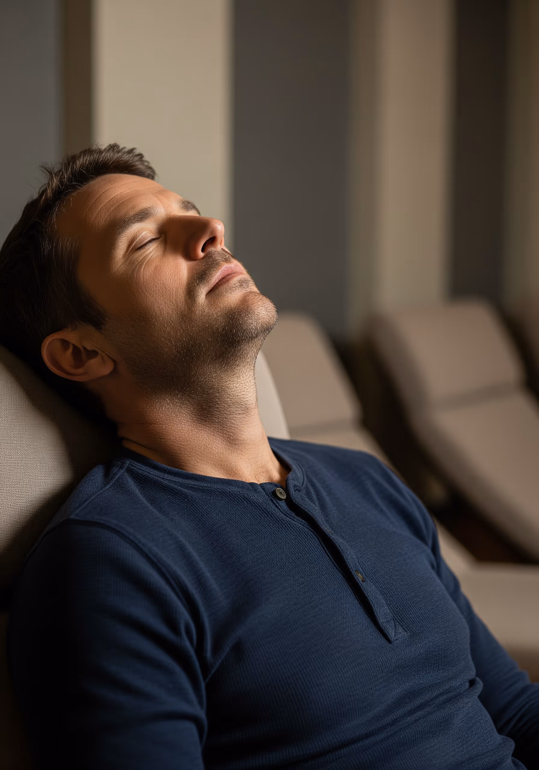 Man resting with eyes closed, reflecting low energy and fatigue addressed by ThrIVwell therapies.