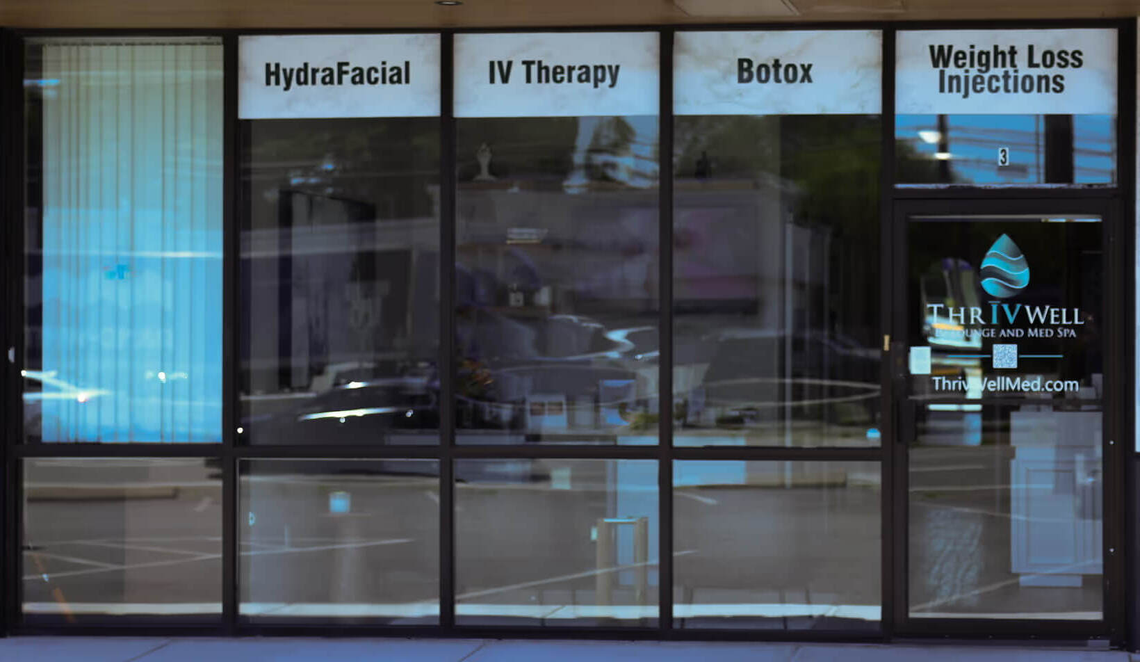 ThrIVwell entrance with service listings including IV Therapy, Hydrafacial™, Botox, and Weight Loss Injections.