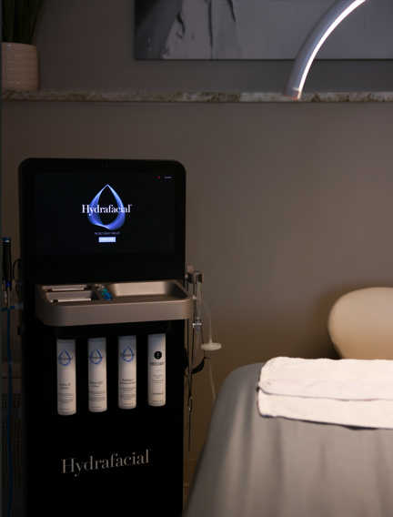 A peach-toned syringe placed on a blush rose, visually expressing ThrIVwell’s gentle aesthetic treatment philosophy.