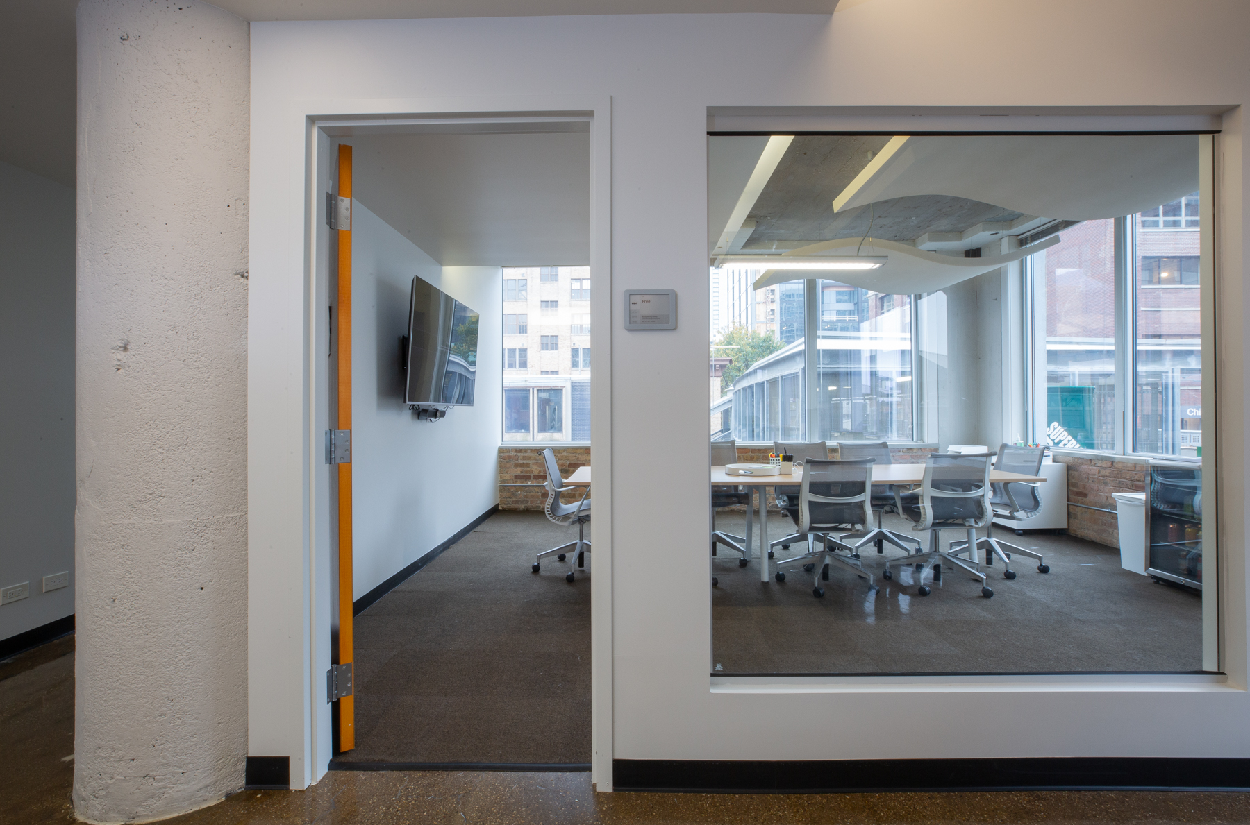 Detail of the 3:0 Conference Room with conference seating and natural light