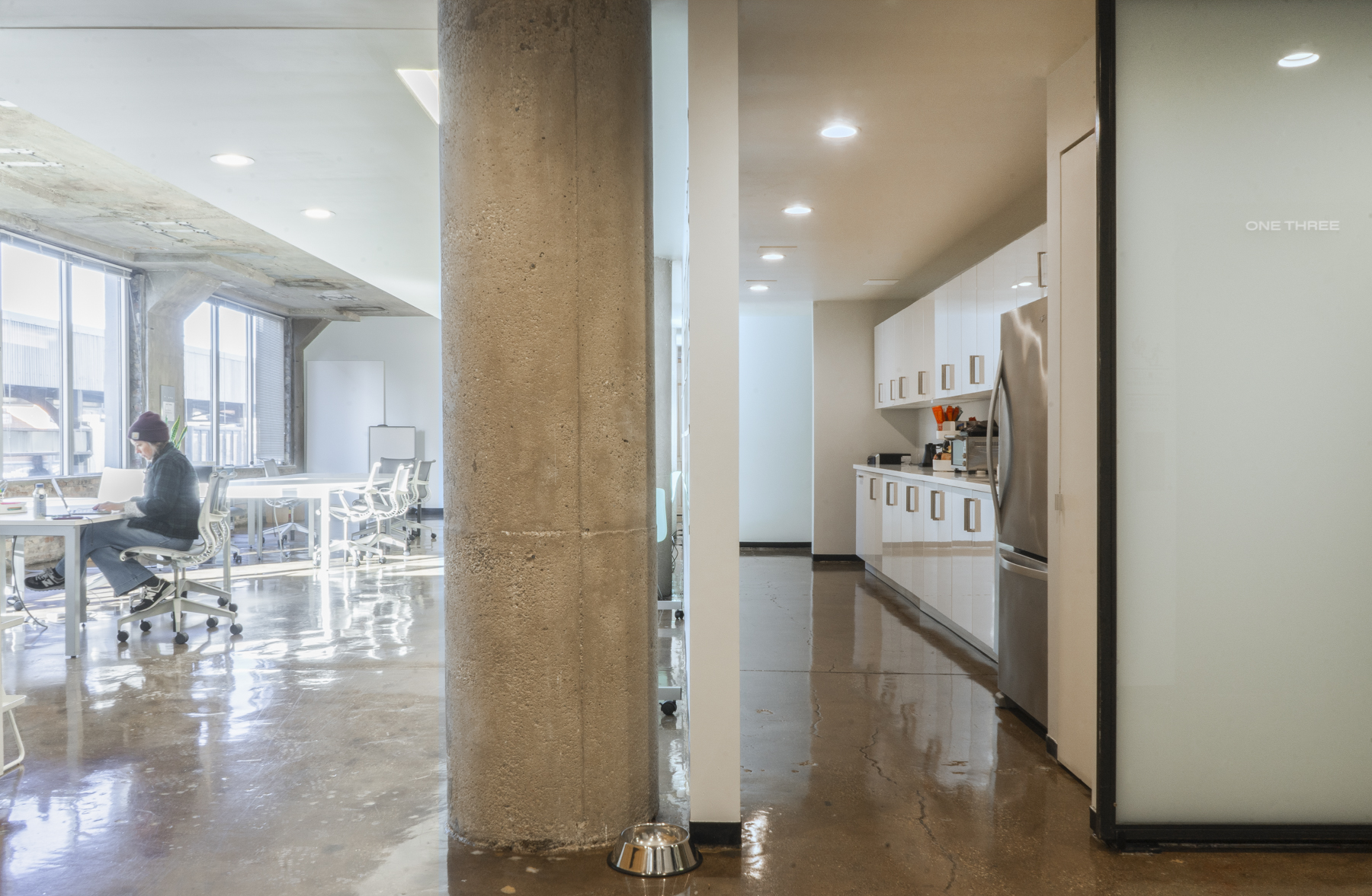 Two Thirty kitchenette stocked with coffee, tea, and snacks for office guests