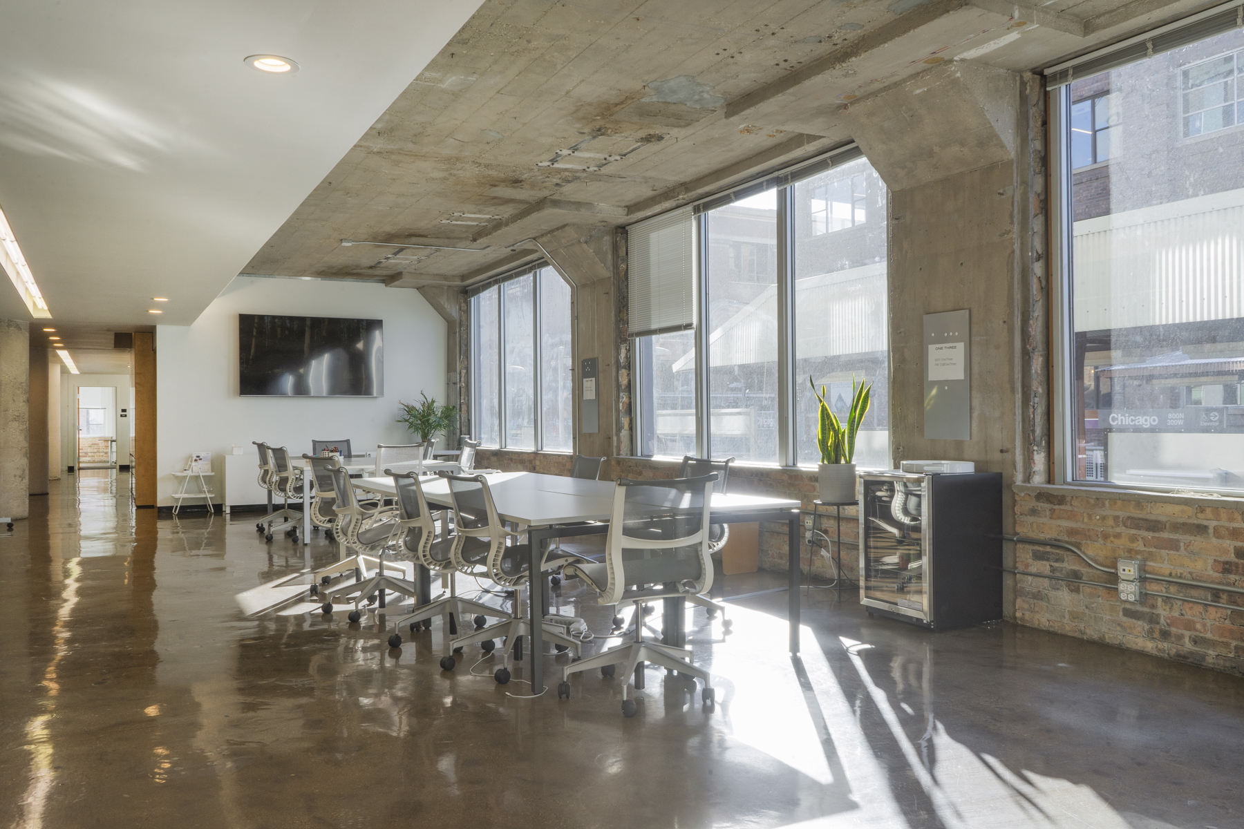 3:6 Event Space arranged for a corporate meeting with large display screen
