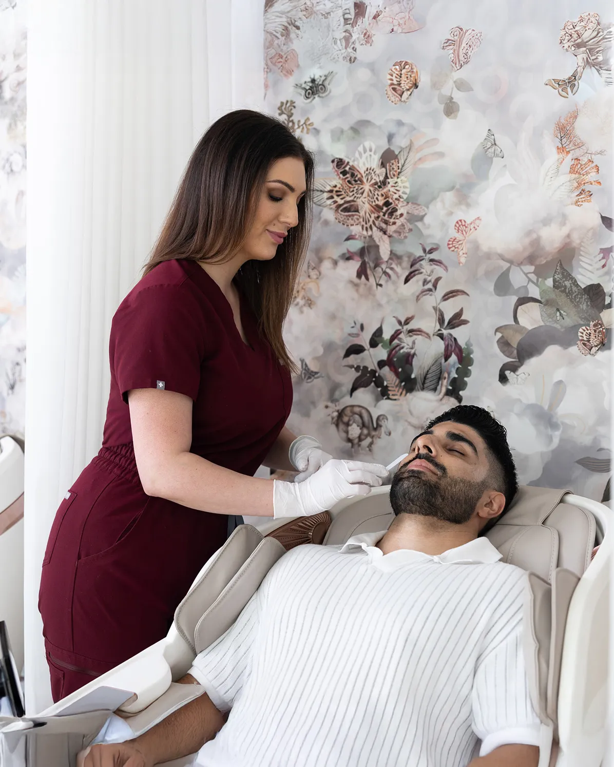 A man getting looked after by a nurse