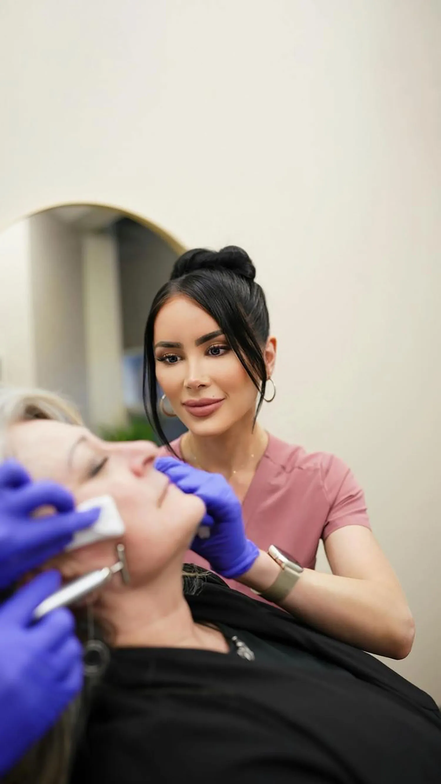 A woman getting treated by a nurse