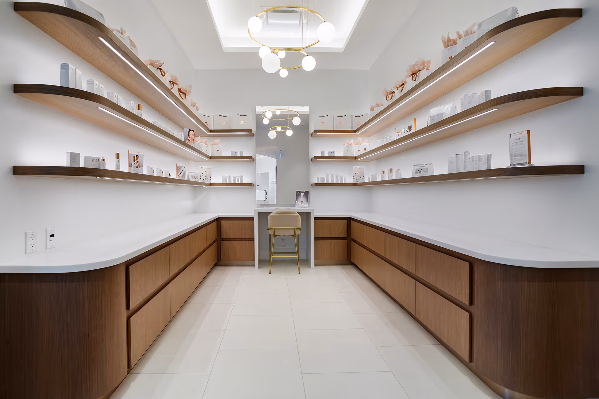 A room with shelves, wooden textured draws and white walls