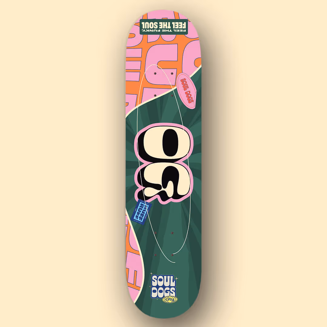 Skateboard deck with colorful green, pink, and orange design featuring the words 'Soul Dogs,' 'Feel the funky, feel the soul,' and 'Ruff Ruff'.